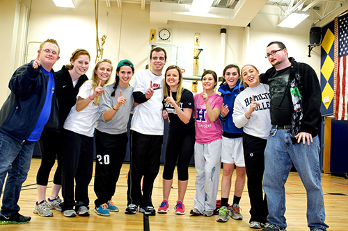 Members of the women's socccer team pose with some Special Olympics athletes after their basketball game.