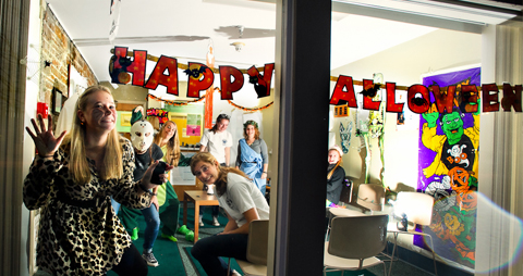 Katie Callahan '15, hangs out in the window of the the Health Center trying to entice trick or treaters during Trust Treat.