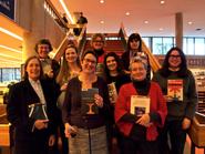 Female faculty authors were honored at a book party.