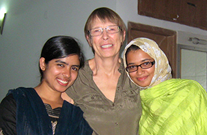 Professor of Biology Jinnie Garrett, center, with students at the Asian University for Women.
