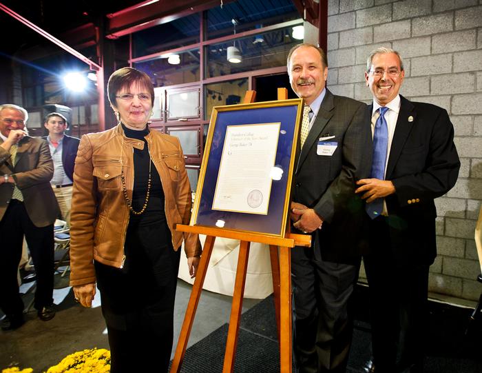 President Joan Hinde Stewart with Volunteer of the Year George Baker '74 and Alumni Association President John Hadity '83. PHOTO: BY NANCY L. FORD
