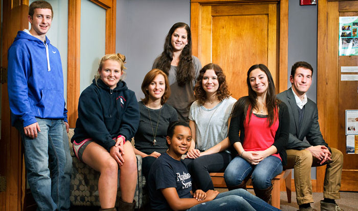 Left-to-right sitting: Sarah Graves, Svitlana Gura, Kate Cieplicki, Angela Pavao, John Rufo; standing Max Newman, Emily Goldberg. On floor Tsion Tesfaye.