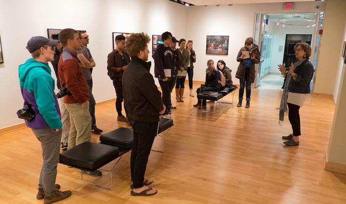 Mary Lee Hodgens, right, gives an overview of Light Work's current exhibition