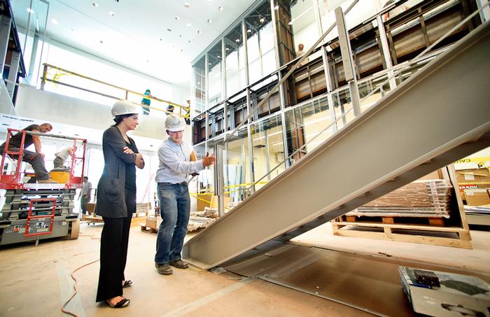 Ned Goodell, right, architect with Machado and Silvetti Associates, discusses plans for the main stairway with museum director Tracy Adler.
