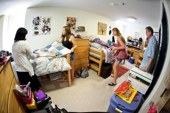 Rachel Pollan '16 makes her bed as Charlotte Beers '16 straightens up in their North Hall room on Aug. 25.