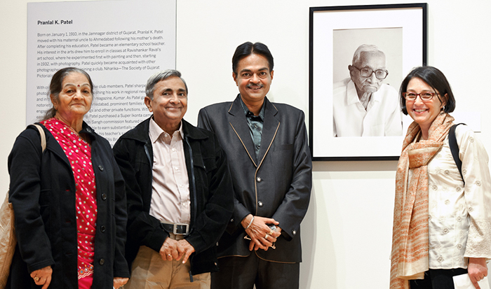 Anand Patel, with his wife Jaya, left, and son Gautam, right, pose with Lisa Trivedi and a portrait of Pranlal Pratel, whose work is on exhibit at the Wellin Museum of Art. PHOTO: NANCY L. FORD