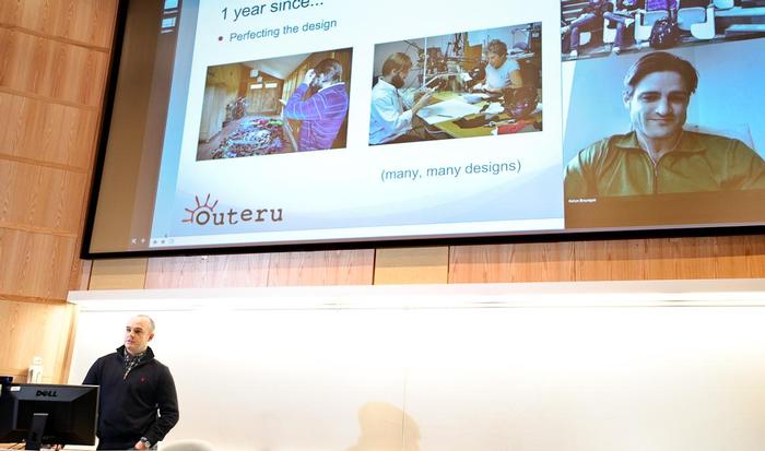 Kevin Bourque '05, left, and Joshua Kunkel '04, on screen, co-founders of Face Glove and winners of the 2012 Hamilton Pitch Competition, give a presentation on preparing for the pitch competition.
