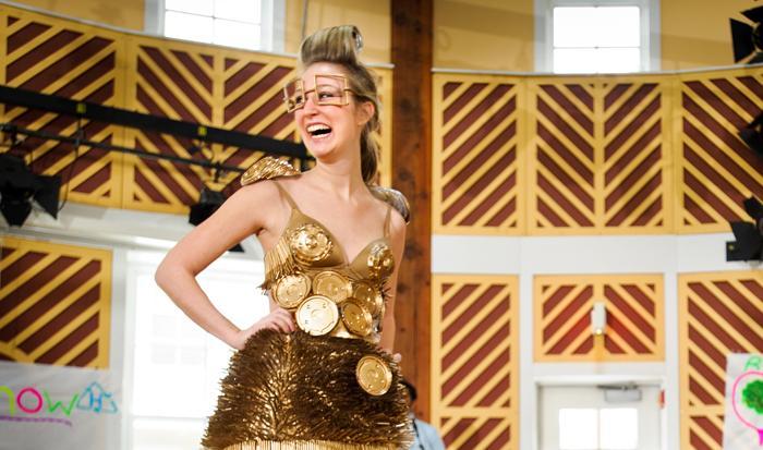 Model Annie Phillips '13 shows off a dress designed by Emily Anderson '13 and made of plastic lids and straws, during the Recycling Task Force's Trashion Show. The dress won first prize.