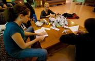 Students assemble paper cranes for 350 day.