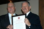 Rand Carter, right, accepts his award from Michael Bosak, president of the Landmark Society of Utica.