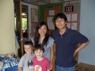 Clinton Early Learning Center students Dalton Eisenhut and Isidor Marcus with Celia Yu '12 and Masaaki Kamiya. 