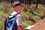 Christopher Abram '04 scouts out the bush in South Africa.