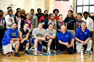 Hamilton athletes and coaches pose for a photo with students from the Citizen Schools of Boston in the Alumni Gym.