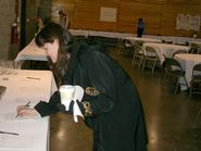 Danelle Parker submits her silent auction bid.