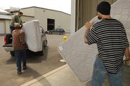 Food Bank volunteers load up mattresses at Physical Plant. Photo by Claudette Ferrone '88.