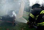 The Clinton Fire Department, shown here at a mock dorm room fire, was among recipients of Town-Gown Fund grants.