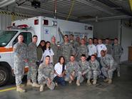 Sujitha Amalanayagam, Caitlyn Williams, Andrew Branting, Keith Willner (standing) and Kathy Lee (kneeling) with Ft. Drum EMT class.