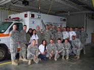 Sujitha Amalanayagam, Caitlyn Williams, Andrew Branting, Keith Willner (standing) and Kathy Lee (kneeling) with Ft. Drum EMT class.