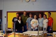 D.C. Hamiltonians pose for a team picture after repainting an elementary school classroom.