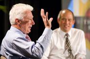 A.G. Lafley '69, former chairman, president and CEO at Procter & Gamble, addresses conference attendees, while Andy Chan, vice president for personal and career development at Wake Forest University, looks on.