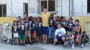 Mike Evans '05 and others playing basketball with boys in Cuba