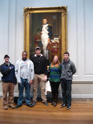 Kevin Prior, Cam Waugh, Knute Gailor, Amy Soenksen and Dylan Wulderk stand by David’s portrait of Napoleon near the rotunda of the National Gallery of Art.