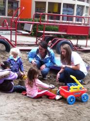 Gigi Fraser '14, left, and Abby Runyon '13 spend time with children at The Neighborhood Center in Utica, N.Y. Photo: Lisa Curtis