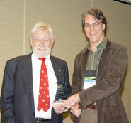 Brent Plate presents Pulitzer Prize-winning poet Gary Snyder with an AAR award.