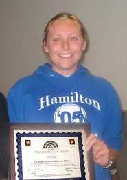 Suzy Belmont '07, Food Salvage operation head, with plaque from Your Neighbors Inc.