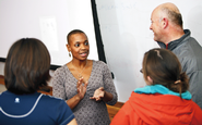 Cynthia Mondesir '95, center, talks with the audience after her lecture.