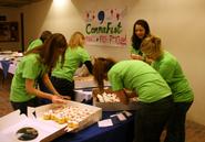 Writing Center tutors decorate cupcakes for CommaFest. Photo by Melissa Balding '09.