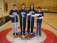 Champion curlers Dave Hamilton, Tom Irvin, Yuqi Mao, Katherine Alser