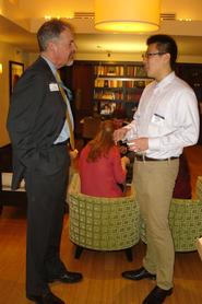 President of the Hamilton DC Alumni Association, Paddy McGuire ’81, talks with Renxiang Wei ’15.