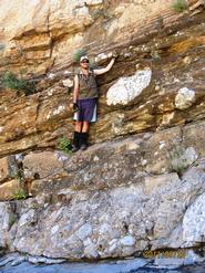 Alex De Moor poses at the base of the Ediacara Period.