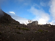 The Cayambe refugio, with the sunlit peak in the background.