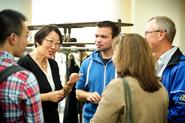 Professor Hong Gang Jin talks with Kevin Rovelli '15 and his parents, Dan Rovelli and Ana Paula Machado during a Family Weekend Tea.