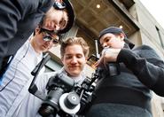 From left,Tom Williams '11, Matt Seaman '12, Dana Quigley '11 and Ben Salzman '13, review a scene they just filmed for their movie. 