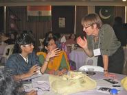 Jinnie Garrett, right, speaks with students at the Asian University for Women in Bangladesh.