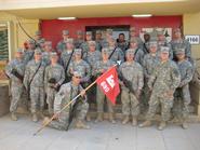 Hamilton employee Sgt. John Gates and his platoon in Iraq.