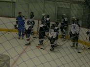 Summer hockey campers assemble on the ice at Sage Rink.