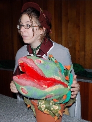 Herbology Professor Sprout displays a plant.