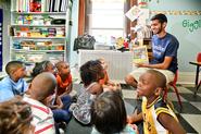 Ishaq Pathan '16 reads to children at Thea Bowman House as part of Hamilton Serves on Wednesday, Aug.29.