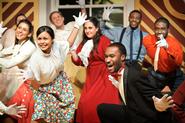 The cast performs the opening number of John B. Davidson's