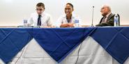 Hector Acevedo 08, Leide Cabral '11 and Roberts Moses '56 lead a discussion,