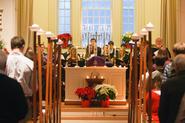 Chaplain Rev. Jeffrey McArn officiated over the Lessons & Carols service with Hamilton students as readers and candle bearers