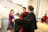 Mary Phillips '11 receives congratulations from Deans Pat Reynolds and Nancy Thompson.