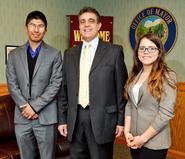 Levitt Leadership Institute students Ujjwal Pradhan '15, left, and Gretha Suarez '15, right, meet with Utica Mayor Robert Palmieri in his office in City Hall.