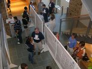 Participants in the MERCURY conference look at student posters in the Science Center atrium.