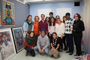 Senior art concentrators and art faculty in Saya Woolfalk's studio.