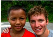 Patrick Cook-Deegan, right, with Laotian student.